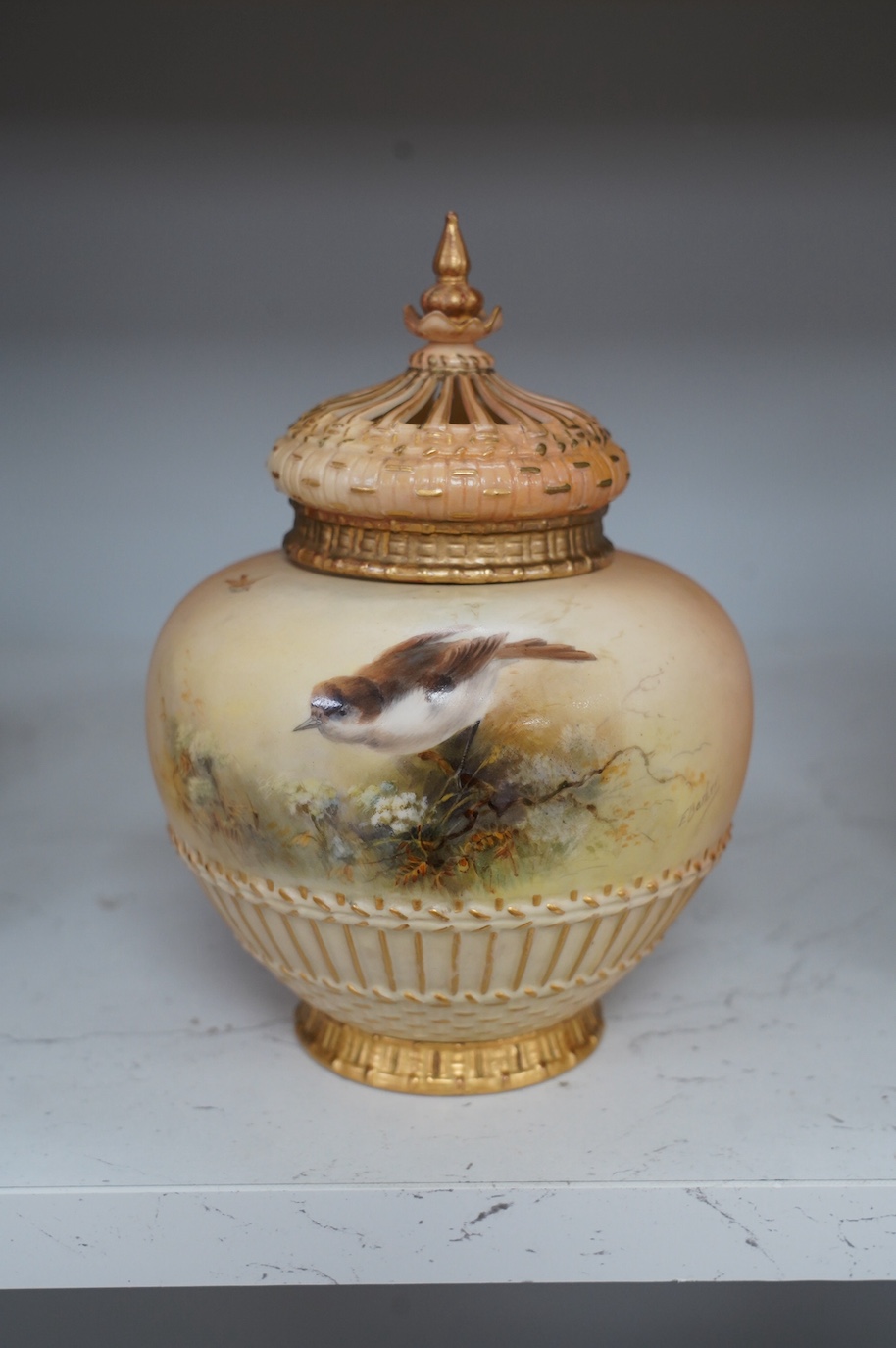 A Royal Worcester bird painted pot pourri and cover, painted by E. Barker, model number 1286, 19cm. Condition - good